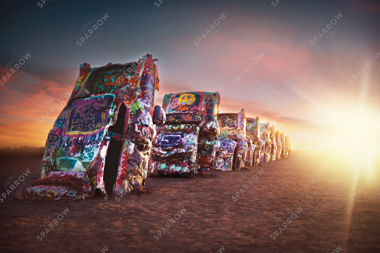 Dawn of Legends, Carrie's landscape photograph of Cadillac Ranch at sunrise.